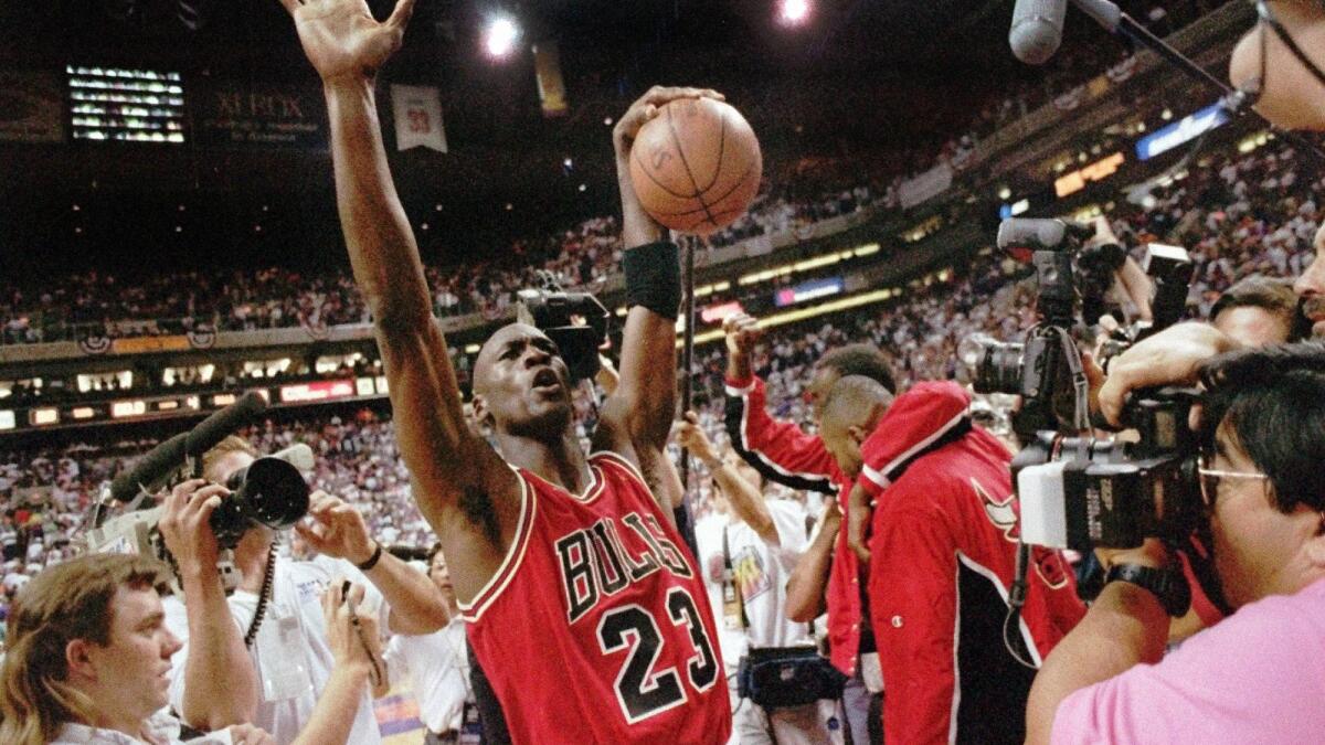 The 1990s Jordan era takes flight Magic battles HIV virus AP News
